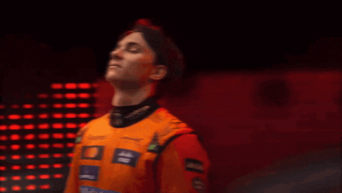 oscar piastr is the name of the man in the orange outfit