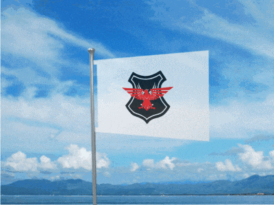 a white flag with a red eagle on it is flying in the wind