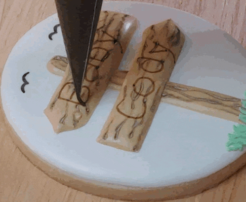 a white plate with a few pieces of wood on it with the letters a and b written on them