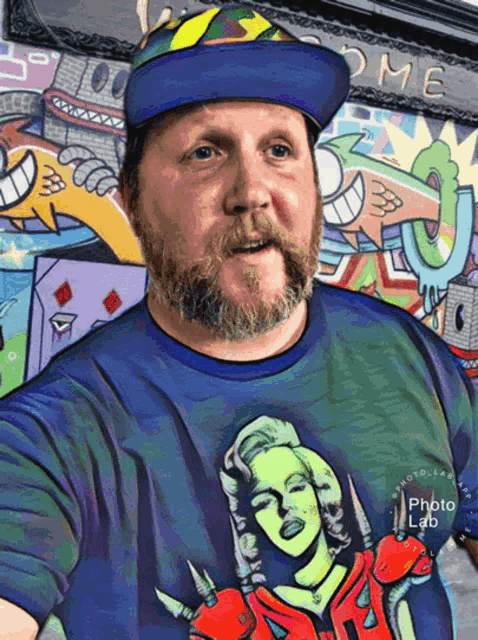 a man wearing a t-shirt with a picture of marilyn monroe