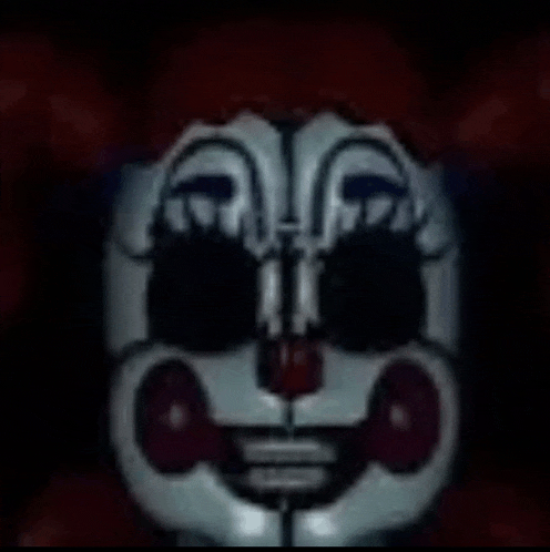 a close up of a clown 's face in the dark with a red background .