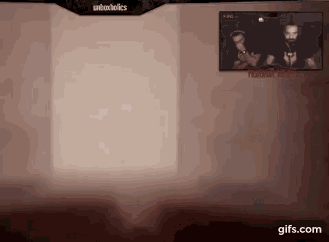 a picture of a man holding a gun is hanging on a wall next to a sign that says unboxholics
