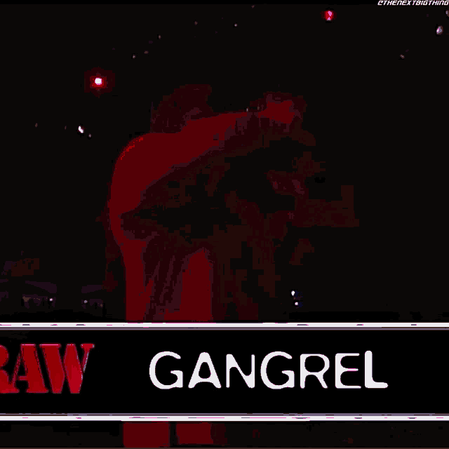 a man in a red robe is singing into a microphone and the name gangrel is on the bottom