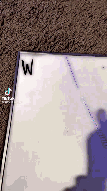 a white board has the letter w on it