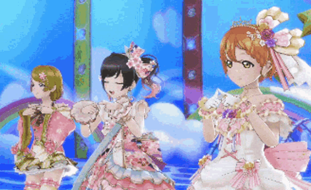 a group of anime girls are standing on a stage with a rainbow in the background