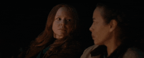 two women sitting next to each other with the words " making offerings to the dirt "