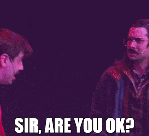 two men are standing next to each other on a stage and one of them is saying sir are you ok ?