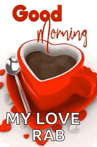 a red cup of coffee in the shape of a heart with a spoon on a saucer .