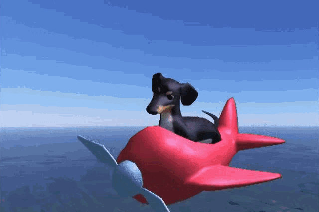 a dog is sitting on top of a red airplane in the sky