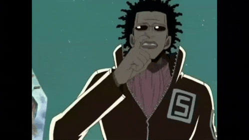 a man with dreadlocks is wearing a jacket with the letter s on the back