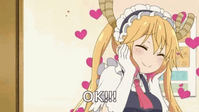 a girl with horns is surrounded by hearts and says `` ok ! ''