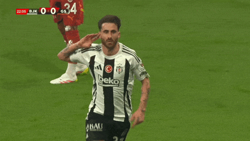 a soccer player wearing a beko jersey celebrates
