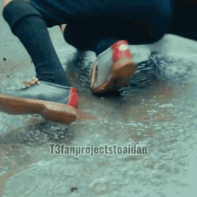 a person 's feet are in a puddle with t3fanprojectstoaidan written below them