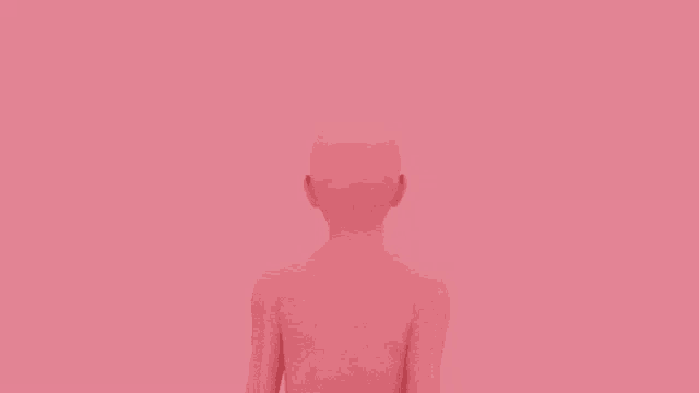 the back of a woman 's body is shown against a pink background