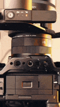 a camera that is made in japan with a lens attached