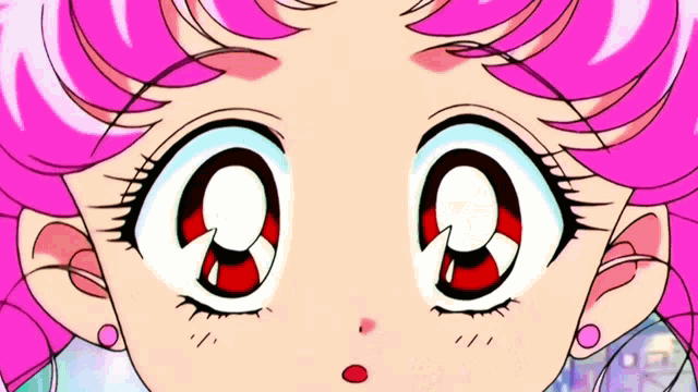 a close up of a girl 's face with pink hair and red eyes