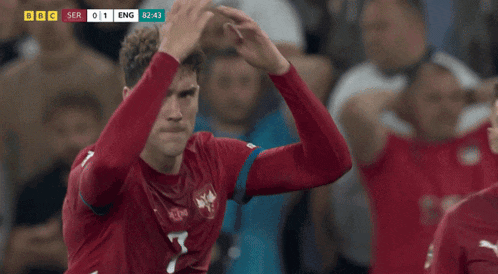 a soccer player in a red jersey with the number 7