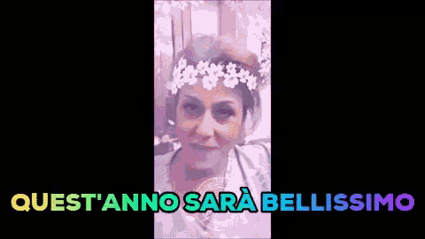 a woman with a flower crown on her head and the words quest 'anno sara bellissimo