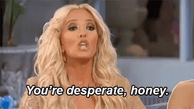 a blonde woman is saying `` you 're desperate , honey '' while sitting on a couch .