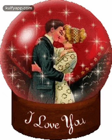 a man and woman are kissing in a snow globe that says i love you .