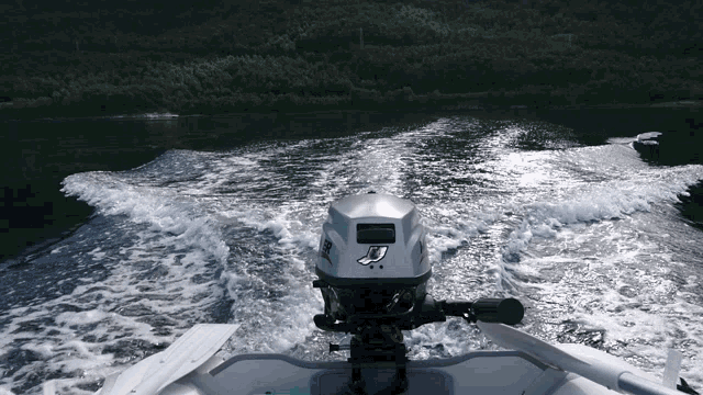 a boat with a mercury outboard motor on the back of it