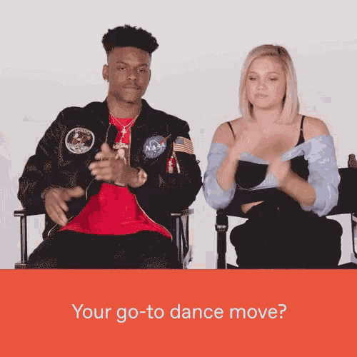 a man and a woman are sitting next to each other with the words " your go-to dance move "
