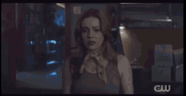 a group of people are standing in a room with a sign that says cw