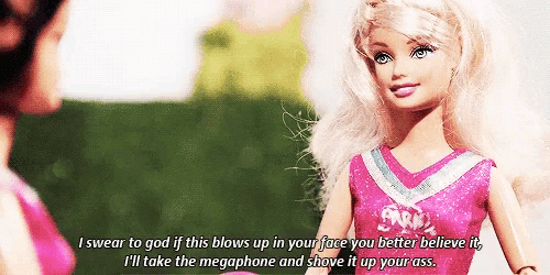 a barbie doll is wearing a cheerleader outfit and saying i swear to god if this blows up in your face