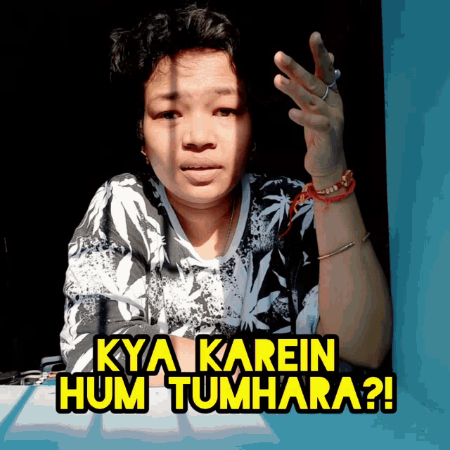 a woman says kya karein hum tumhara on a blue wall