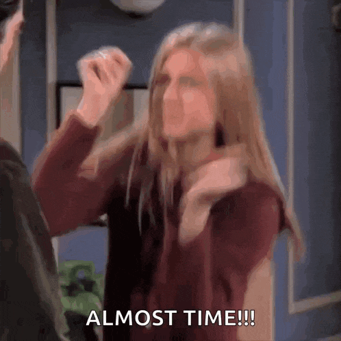 a woman is giving a fist bump to a man and the words `` almost time '' are visible .
