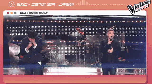 two men singing in front of a screen that says the voice