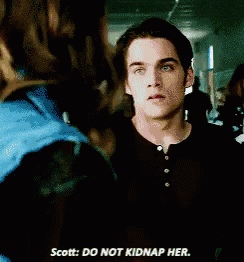 a man talking to a woman in a hallway with the words scott do not kidnap her
