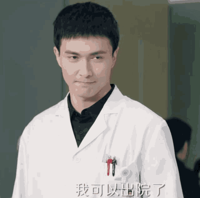 a man in a white lab coat has a pen in his pocket with chinese writing on it