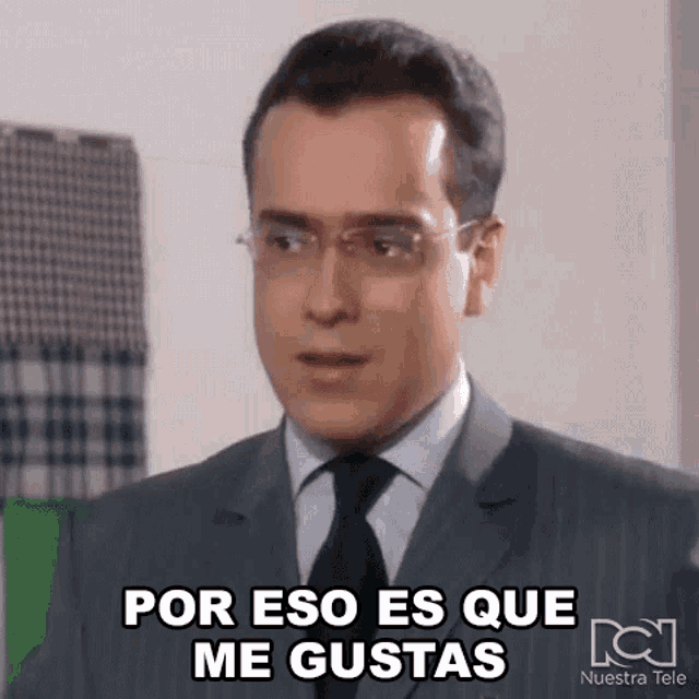 a man in a suit and tie is making a funny face and says por eso es que me gustas
