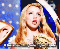 a blonde woman is holding a crown and says if there 's nothing missing in my life