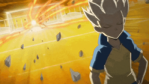 a boy with white hair is standing in front of a soccer goal