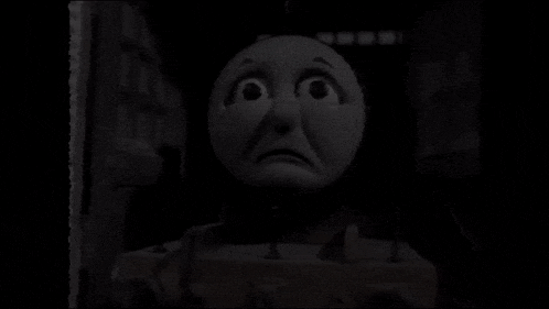 a black and white photo of a cartoon character with a stomach coming out of it 's mouth .