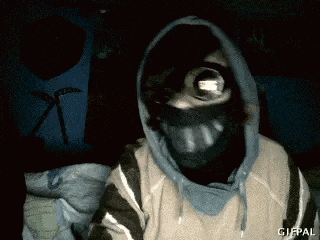 a person wearing a mask and a hoodie has a gifpal watermark on the bottom right