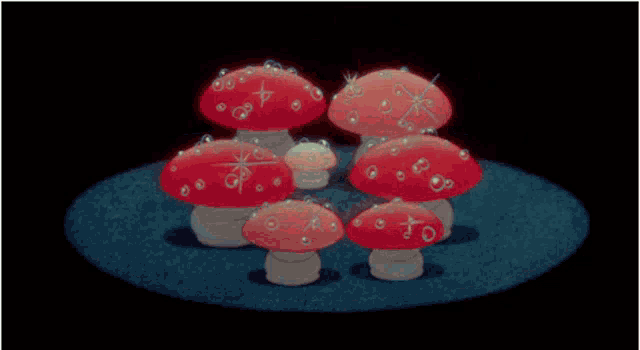a group of red mushrooms are surrounded by bubbles on a blue surface