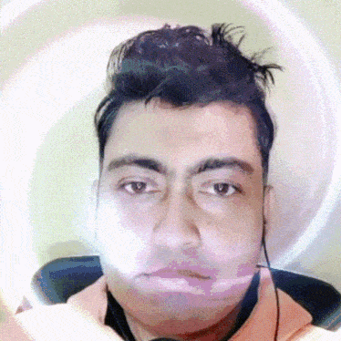 a close up of a man 's face with a circle around it
