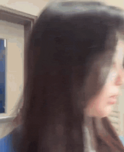 a blurry picture of a woman 's face and hair