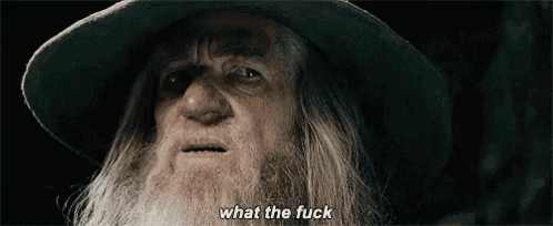 a man with a beard is wearing a hat and saying what the fuck .