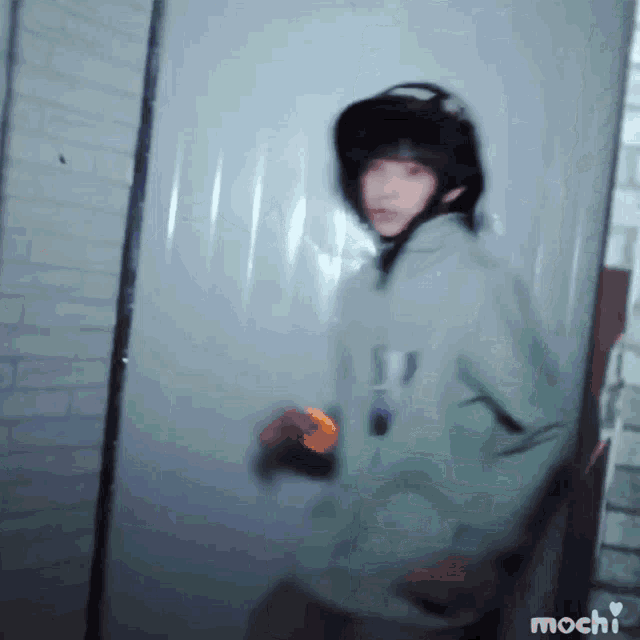 a blurry photo of a person with the word mochi on the bottom right