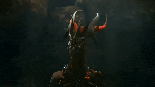 a robot is flying through the air in a dark room in a video game .