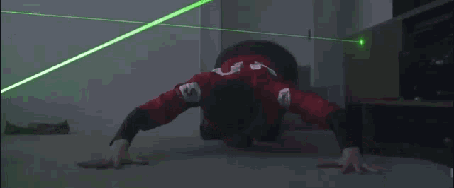 a man in a red shirt with the number 5 on it is doing push ups