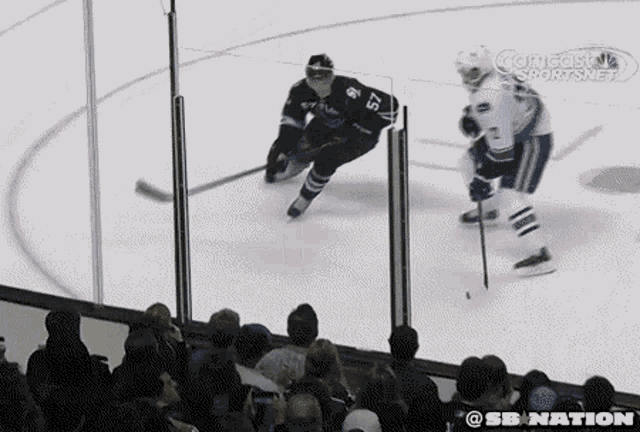 a hockey player with the number 15 on his jersey is skating