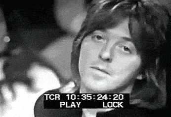 a black and white photo of a man 's face with a time stamp that says tcr 10:35 24:20 play lock .