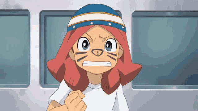 a cartoon character with a cat face and a blue hat