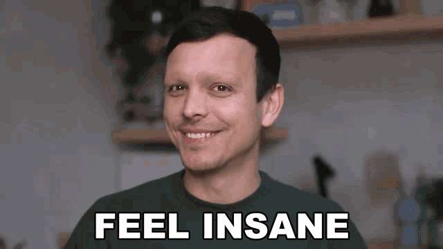 a man in a green shirt smiles with the words feel insane behind him