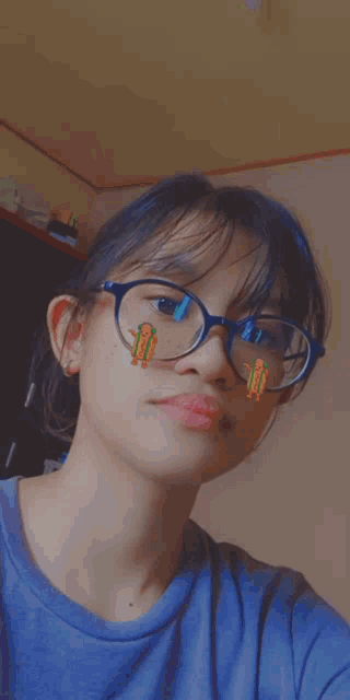 a close up of a person wearing glasses with a hot dog sticker on their face